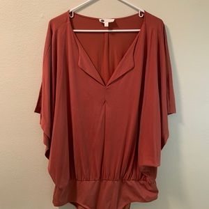 Burnt orange flowy body suit